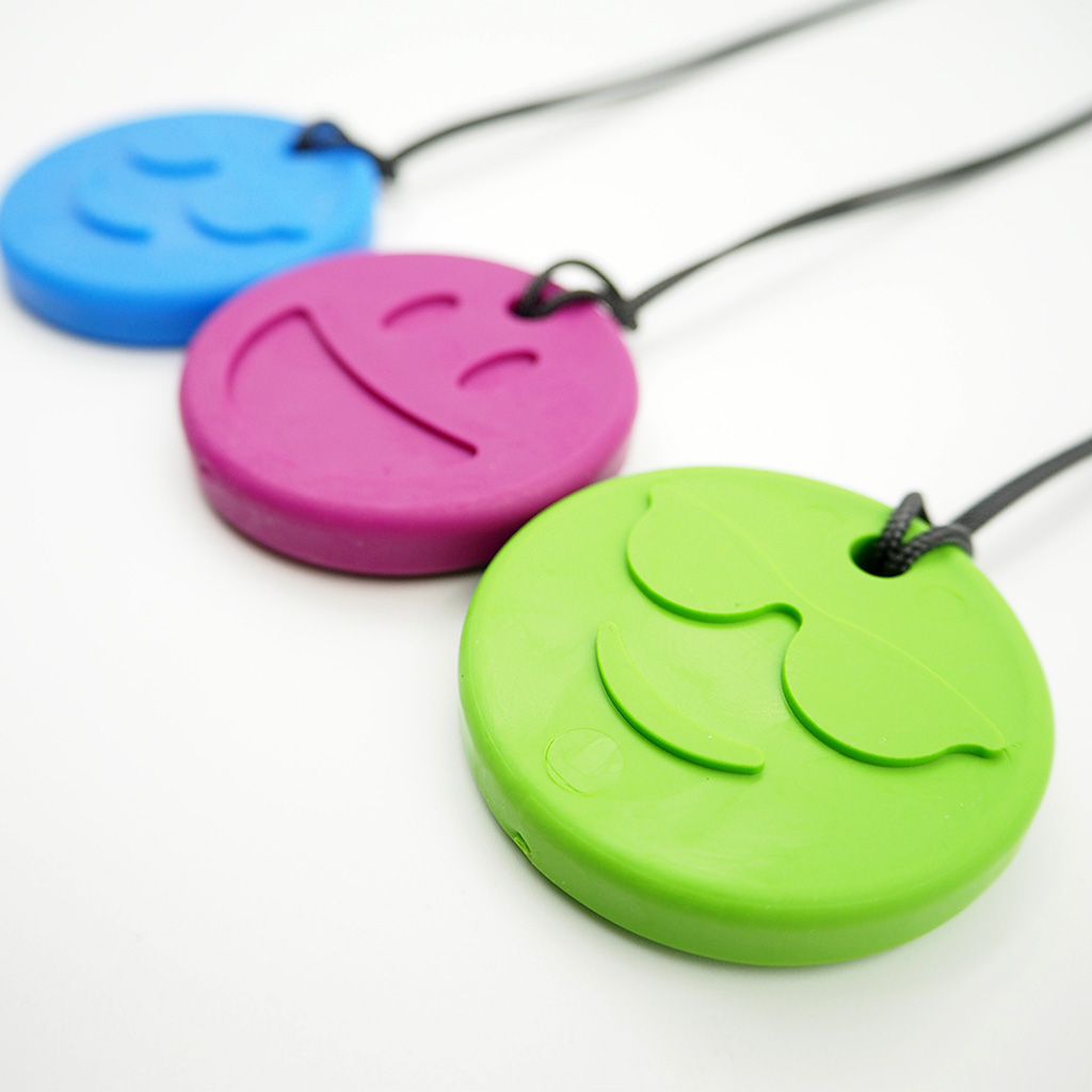 One green smiley necklace, one purple smiley necklace and one blue smiley necklace.